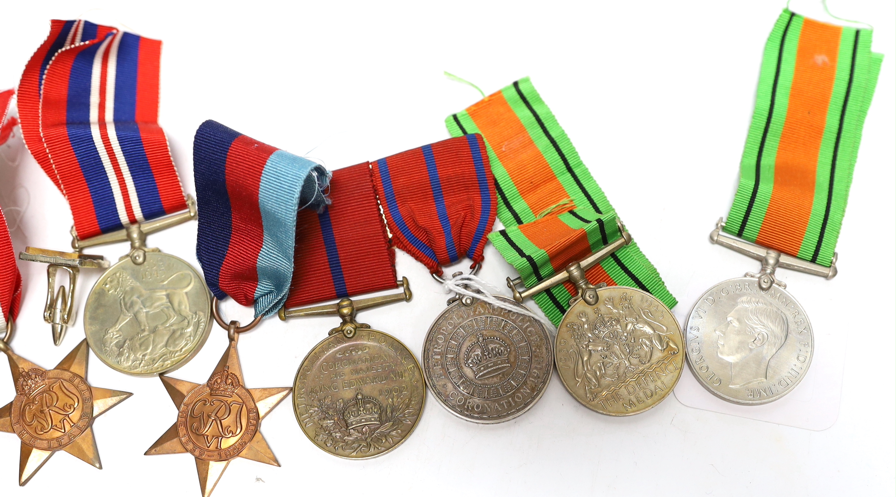 Group of assorted medals including; a pair of Metropolitan Police Coronation medals for 1902 and 1911 to P.S. A. Grunsell P. Div., together with six WWII medals; three Defence Medals, a War Medal, a 1939-45 Star and an I